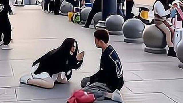 Frustrated Woman In China Kneels In Public, Begs Admirer To Stop Chasing Her