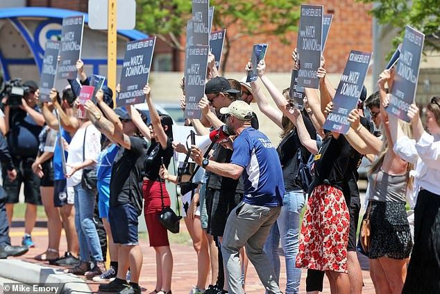 butcher shop supporters throw meat at vegan protestors 