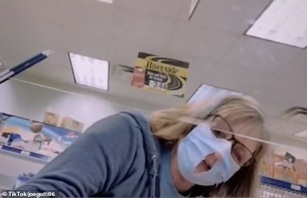 woman cuts hole in face mask because it’s “easier to breathe”