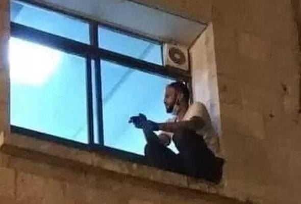 man climbs pipeline, sits by window to see covid-19 positive mother