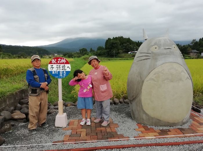 these grandparents built a life-sized totoro bus stop for their grandchildren!