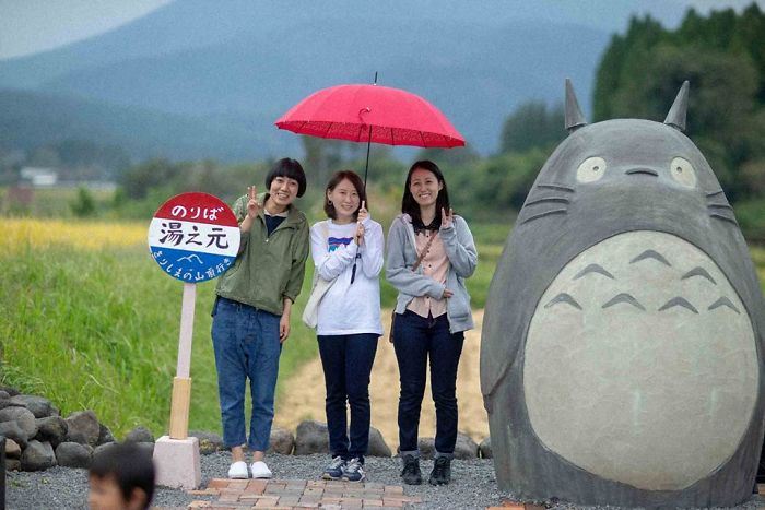 these grandparents built a life-sized totoro bus stop for their grandchildren!