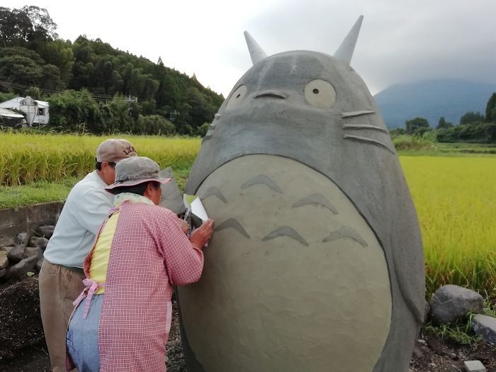 these grandparents built a life-sized totoro bus stop for their grandchildren!