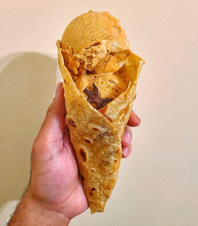 a new fusion dish: tea ice cream wrapped in a paratha cone ?