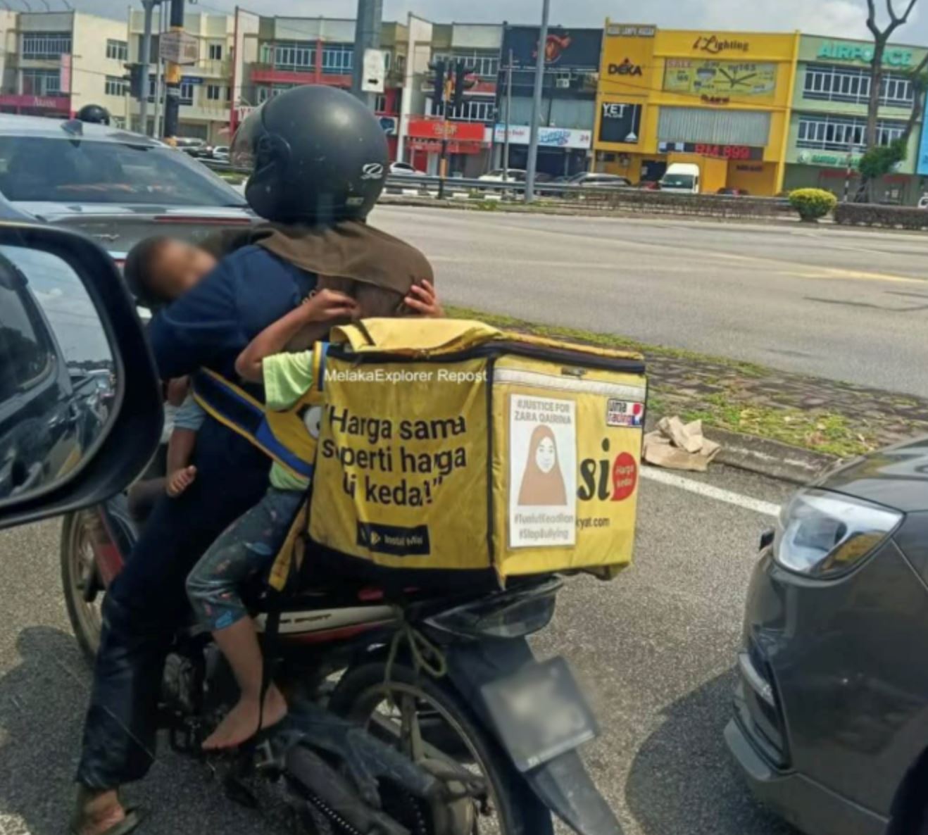 viral photo of melaka mum delivering food with her three children sparks conversation online